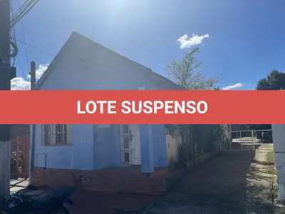 LOTE 001 - Terreno com benfeitorias com área de 365,50m2 com frente para a rua Coronel Cristóvão Gomes de Andrade na cidade de Camaquã/RS.