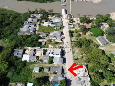 LOTE 001 - 50% do imóvel : Lote urbano número 19-A (dezenove-A) da quadra número 18 (dezoito) com área de 572,48m² , com frente para a rua Irineu Atahualpa Cibils, no bairro Centro, na cidade de Arambaré-RS