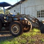 LOTE 007 - Trator Agrícola New Holland - Modelo TL 75E - 4X4 - Ano/Modelo:  2009/2009 - Cor: Azul - Combustível: Diesel -