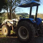 LOTE 007 - Trator Agrícola New Holland - Modelo TL 75E - 4X4 - Ano/Modelo:  2009/2009 - Cor: Azul - Combustível: Diesel -